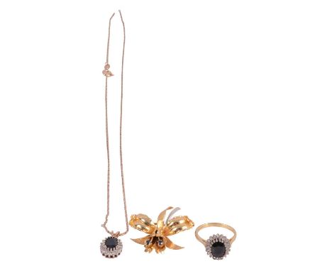 A sapphire and diamond ring, necklace and sapphire brooch, a sapphire and diamond oval cluster ring, the oval mixed cut sapph