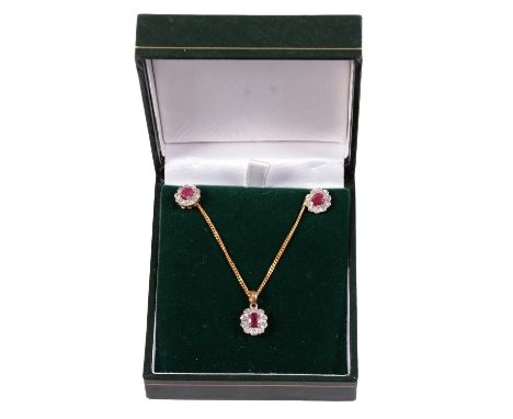 An ruby and diamond pendant and chain with matching earrings, the 10x9mm pendant set with an oval mixed cut ruby and ten 8 cu