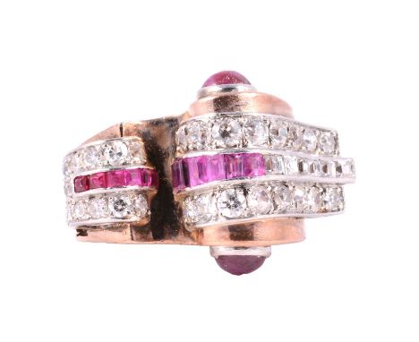 An Art Deco ruby and diamond cocktail ring, Odeonesque design, the flying scroll and arched top set with forty old cut and ol