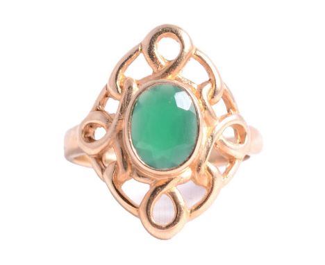 A 9 carat yellow gold dress ring with oval faceted green stone ring size K, pierced scroll surround, 3.8g.