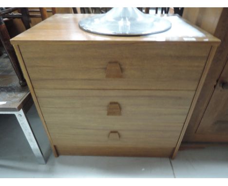 A vintage teak effect laminate 3 drawer chest