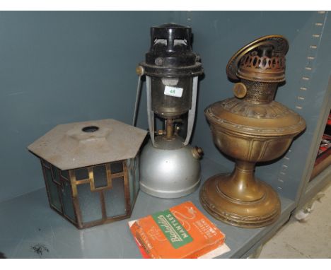 A selection of lights including shade Tilley and oil lamp
