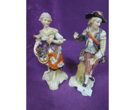 Two ceramic figures hand decorated bearing red cross mark in a Dresdon style