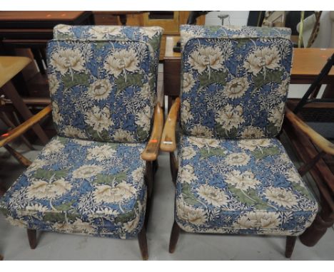 A pair of Ercol style part stripped armchairs