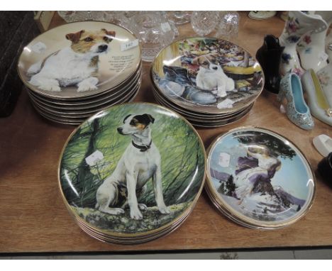 A selection of ceramic display plates many Jack Russell themed