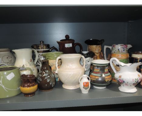 A selection of ceramic jugs tea and coffee pots etc