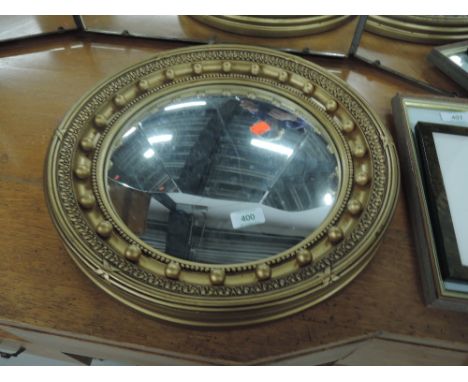 A vintage gilt frame circular wall mirror