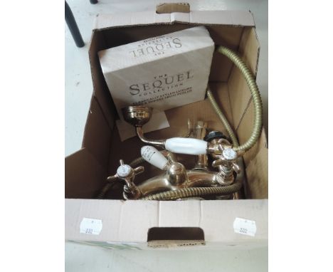 A selection of bathroom taps brass and ceramic with mixer