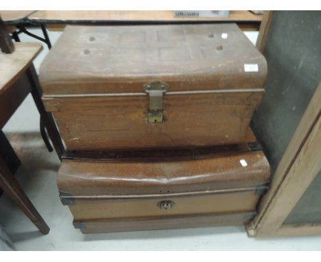 Two vintage tin travel trunks