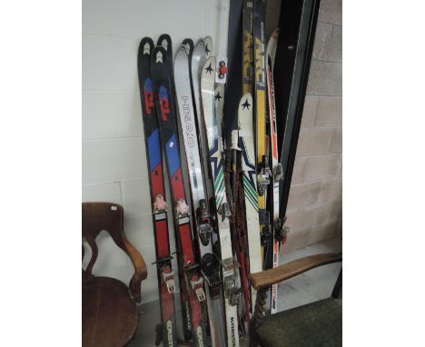 A selection of vintage skis and poles