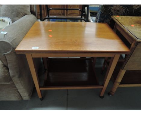 A vintage teak effect tea trolley