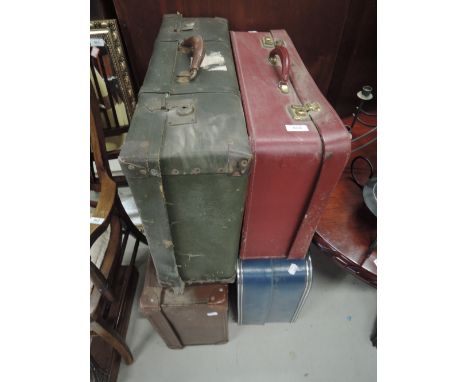 Four assorted vintage suitcases