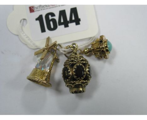 A 9ct Gold Novelty Windmill Charm/Pendant, together with a 9ct gold lantern style charm/pendant, of openwork design with claw
