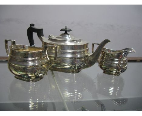 A Hallmarked Silver Bachelor's Three Piece Tea Set, R&amp;S, London 1927, each of plain oval design with angular loop handles