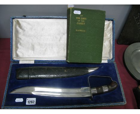 A Middle Eastern Bowie Knife, with leather scabbard (cased); H.G. Wells: In the Days of the Comet, September 1906 first editi