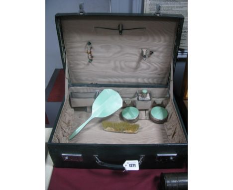 A Dark Green Leather Ladies Travelling Case, part fitted with pale green enamel backed brush, hand mirror, bottle and lidded 