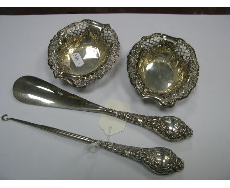 A Pair of Hallmarked Silver Dishes, of shaped openwork design; together with a hallmarked silver handled button hook and shoe