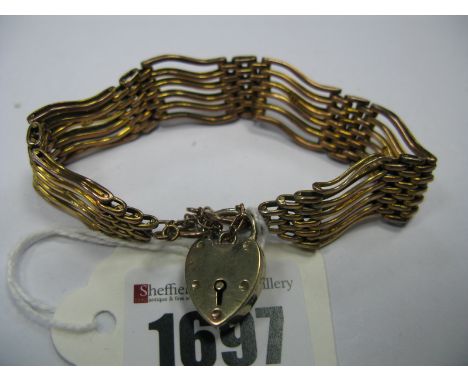 A Chester Hallmarked 9ct Gold Gate Style Bracelet, of openwork design, to heart shape padlock fastener and safety chain.