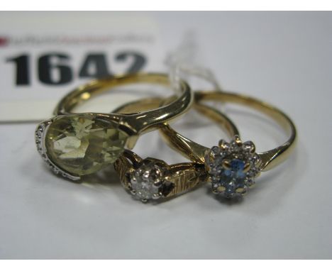 A 9ct Gold Cluster Ring, of flowerhead design, claw set throughout, between tapered shoulders; a 9ct gold single stone ring, 