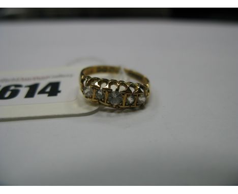 An 18ct Gold Victorian Style Diamond Ring, the old cut stones claw set, between openwork setting and shoulders.