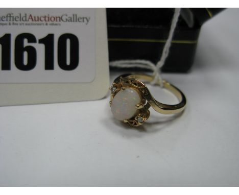 A Modern Dress Ring, Claw Set Highlights, within openwork twist shoulders, stamped ''585''. 