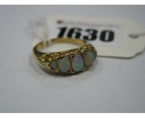 A Chester Hallmarked 18ct Gold Victorian Style Dress Ring, graduated inset cabochon highlights, within textured setting.