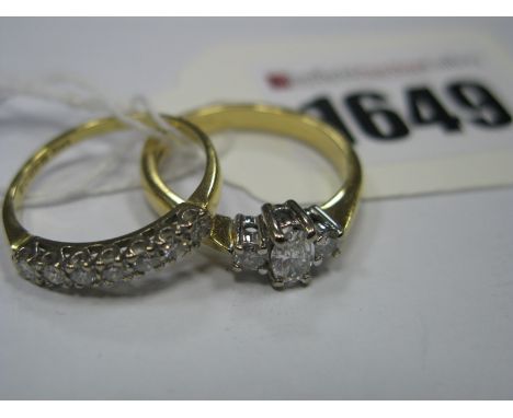 A Modern 18ct Gold Diamond Three Stone Ring, the oval centre stone claw set, between brilliant cut claw set stones, within ta