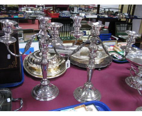 A Matched Pair of Plated Twin Branch Candelabra, (each converting to a single candlestick), raised on circular base, 35.5cm a