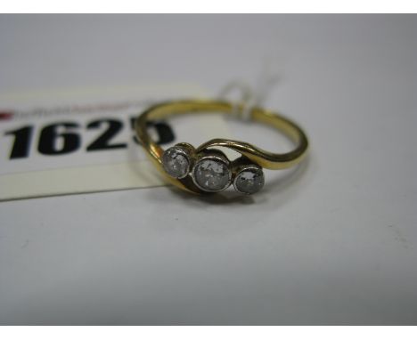 A Three Stone Diamond Ring, the graduated old cut stones crossover set.