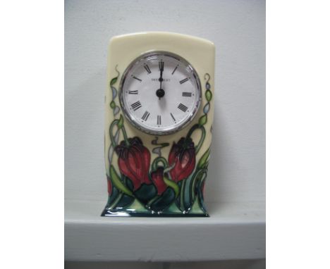 A Moorcroft Pottery Clock in the "Pretty Penny" Pattern, CL1, designed by Rachel Bishop, 15.5cm high.