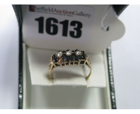 A Modern 9ct Gold Dress Ring, claw set throughout (one stone missing).