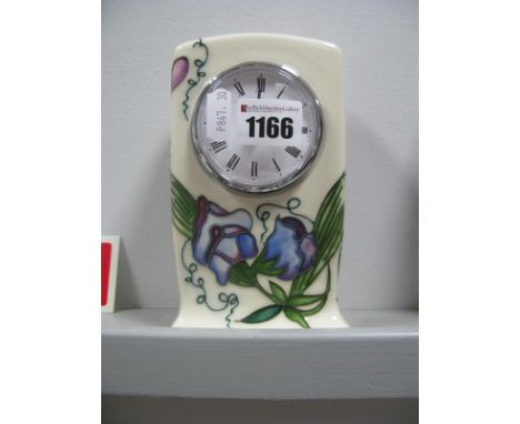 A Moorcroft Pottery "Sweetness" Pattern Clock, designed by Nicola Slaney, CL1, 15.5cm high.