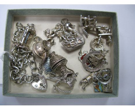 A Hallmarked Silver Curb Link Bracelet, to Heart Shape Padlock Fastener, and safety chain, a  selection of novelty charms, in