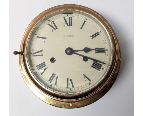 A reproduction ships clock in brass case, the circular dial marked “Celeste”, 14cm diameter dial