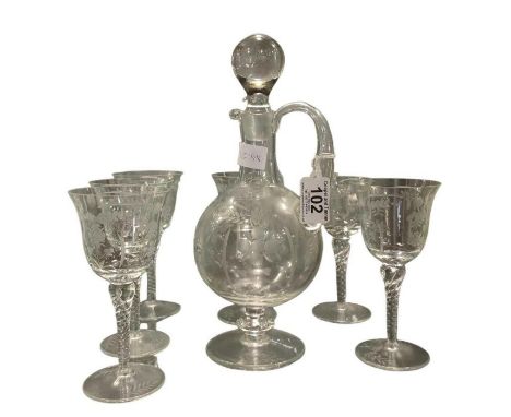 A pedestal glass decanter with solid stopper and acid etched decoration, 31.5cm high together with a matching set of six stem