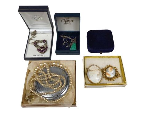 Two cameo brooches, a two row simulated pearl necklace, a compact and other items