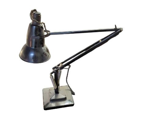 An angle poise lamp, black painted, with square weighted base