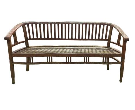 A weathered teak garden bench with curved seat rest by the solid wood company, 166cm wide, 87cm high, 61cm deep