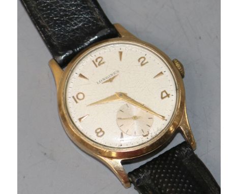 A gentleman's 9ct gold Longines manual wind wrist watch.