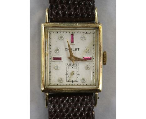 A lady's 14ct gold Chalet rectangular cased manual wind wrist watch.