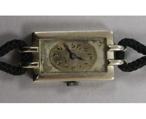 A lady's 18ct white gold Rolex rectangular dial manual wind wrist watch.
