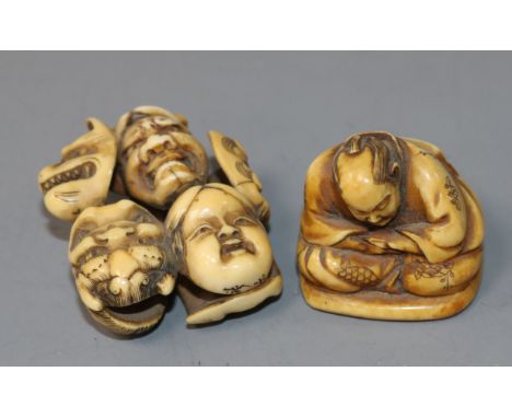 A Japanese ivory netsuke carved with nine Noh masks and another of a seated man asleep, both signed (2)