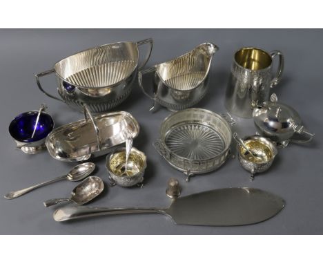 Mixed silver, to include a 19th silver caddy spoon, a silver cream and sugar, four silver condiments, a silver christening mu