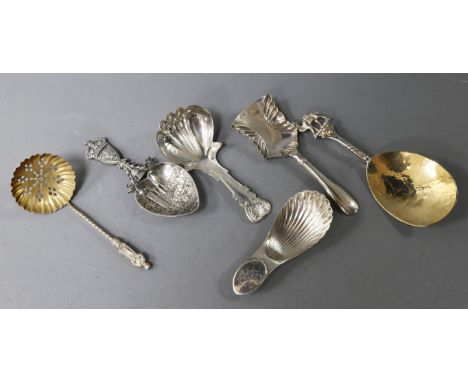 Three various 19th century silver caddy spoons, a modern parcel gilt spoon by Michael Allen Bolton and two other spoons inclu