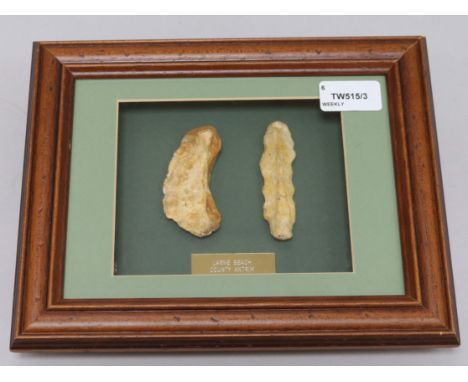 A collection of framed Neolithic and other tools and flint arrow heads, including a Paleolithic fine pointed hand axe, Clacto