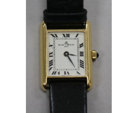 A lady's 18ct gold Baume & Mercier rectangular dial manual wind wrist watch.