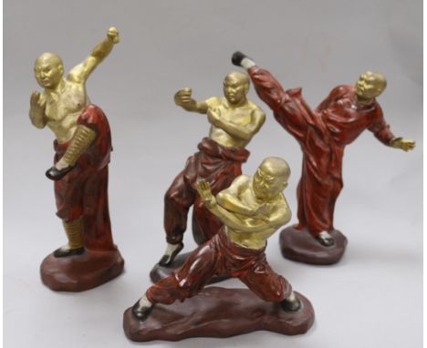A set of four ceramic figures of boxers
