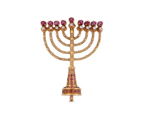 
	
		AN 18 CARAT GOLD RUBY AND DIAMOND MENORAH BROOCH
		The Menorah arms with brilliant cut diamond and circular cut ruby tip
