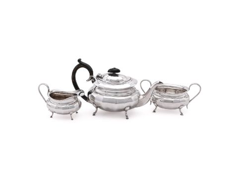 
	
		A SILVER THREE PIECE OVAL BALUSTER TEA SET
		VINER'S LTD., SHEFFIELD 1959
		The tea pot with an oval wood finial and loo