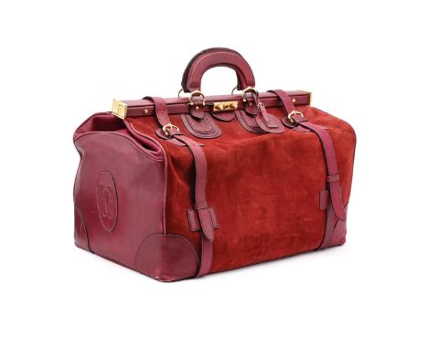 
	
		CARTIER 
		A BURGUNDY LEATHER AND SUEDE DOCTOR'S BAG
		With twin leather loop handles and fastening straps, key lock cla